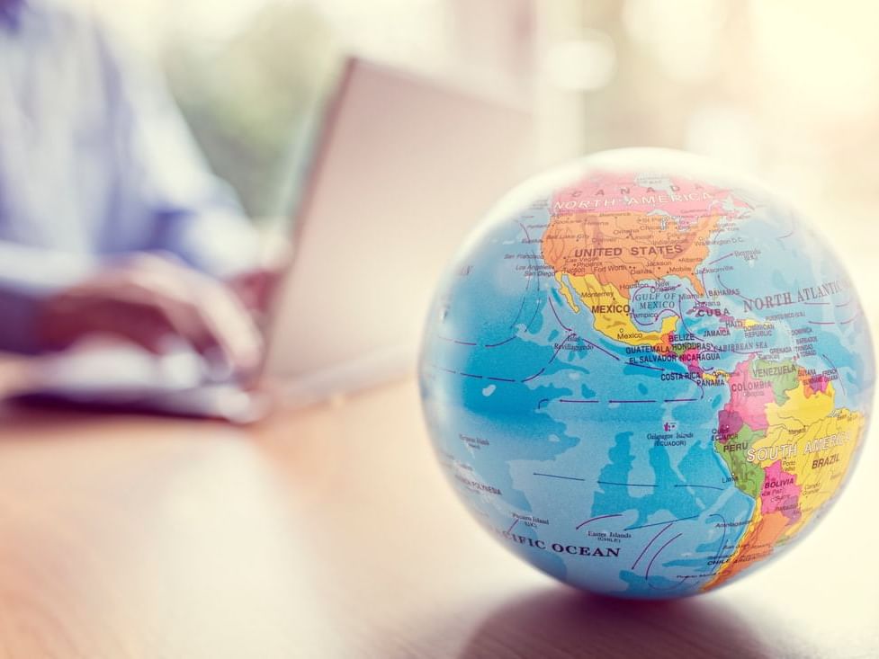 Close-up of a world globe on a table at The Abidah Hotel