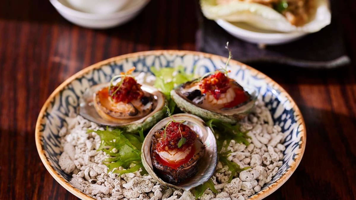 Three seasoned oysters served in Silks Restaurant at Crown Hotel Melbourne