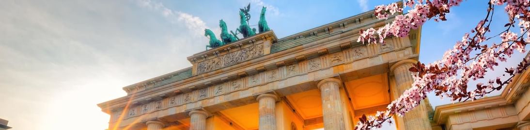 Low-angle view of Brandenburg Gate near Titanic Gendarmenmarkt Berlin