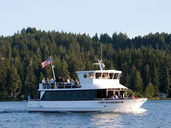 People on a caven boat on canal at Alderbrook Resort & Spa