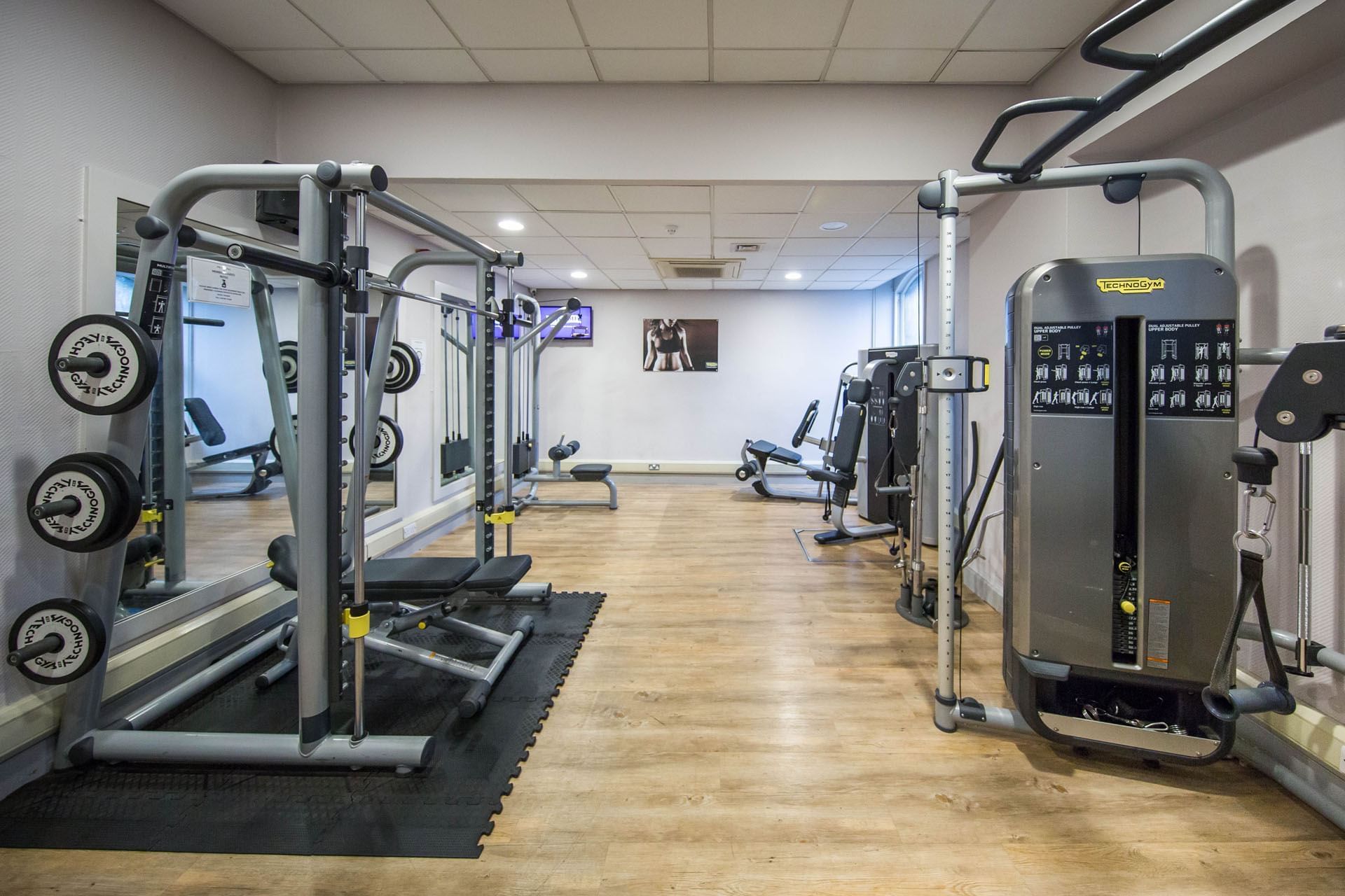 The Gym with weights, mirrors, and equipment for exercise at The Milner York