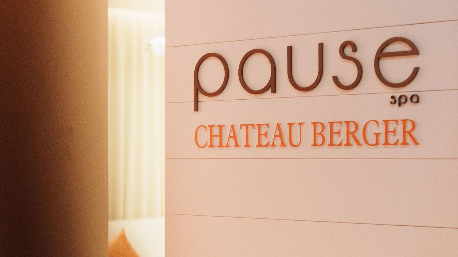 Signage for Pause Spa at Chateau Berger on a light background at Paramount Hotel Dubai