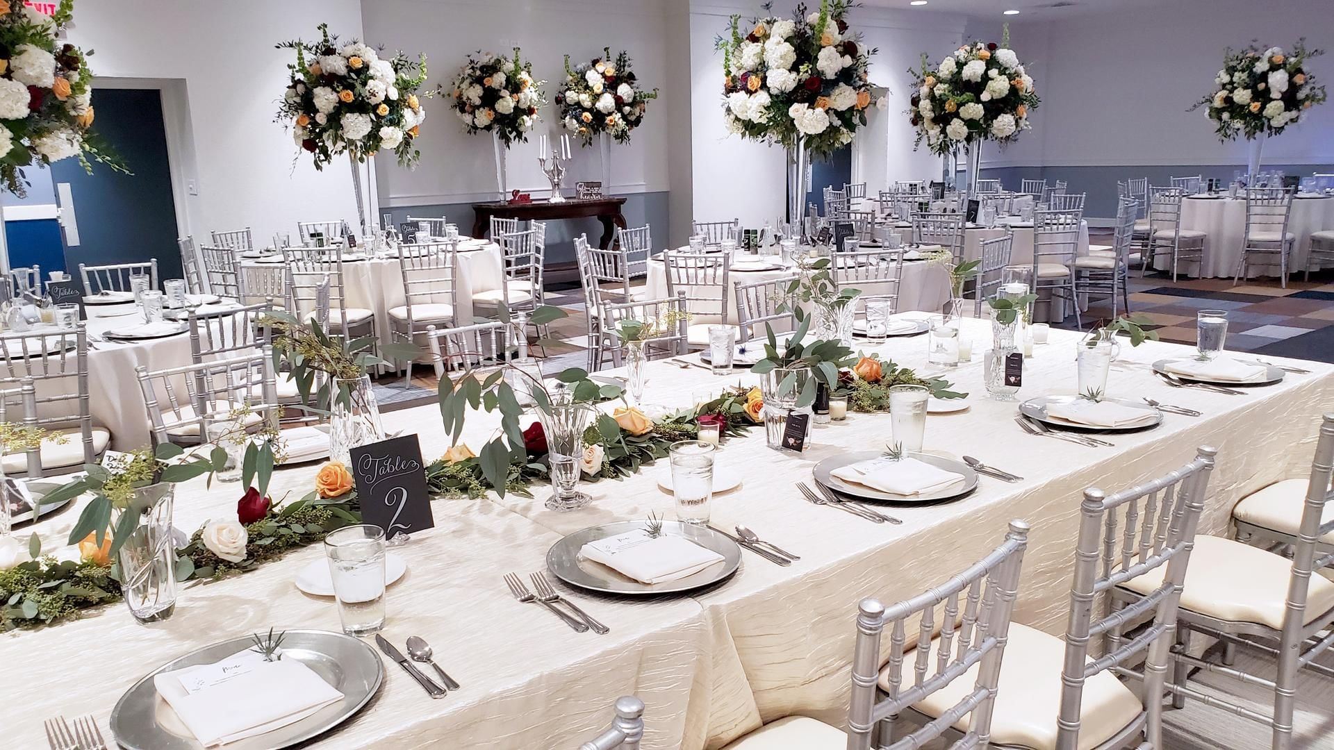 Elegant wedding setup at The Barrymore Hotel with chairs, floral decor, and neatly arranged tables