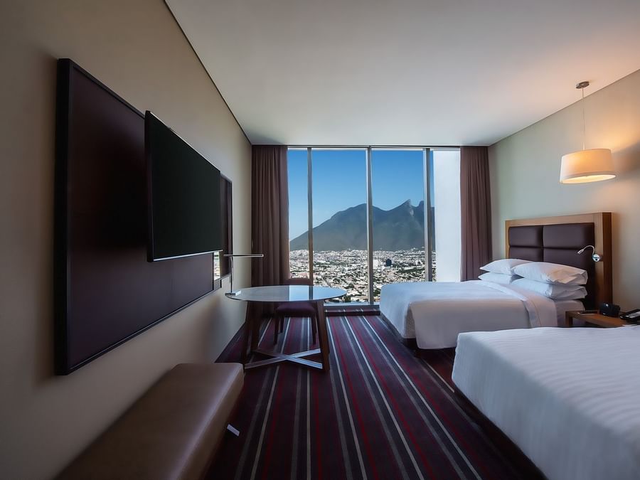 2 Double beds, TV in Deluxe Room at FA Monterrey Pabellon M