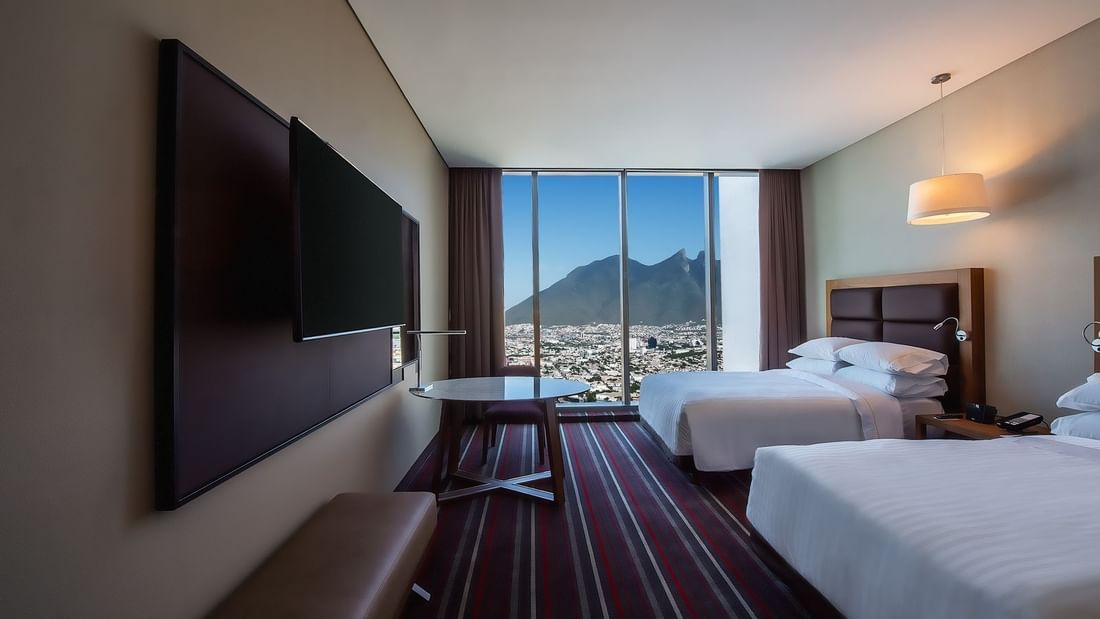 2 Double beds, TV in Deluxe Room at FA Monterrey Pabellon M