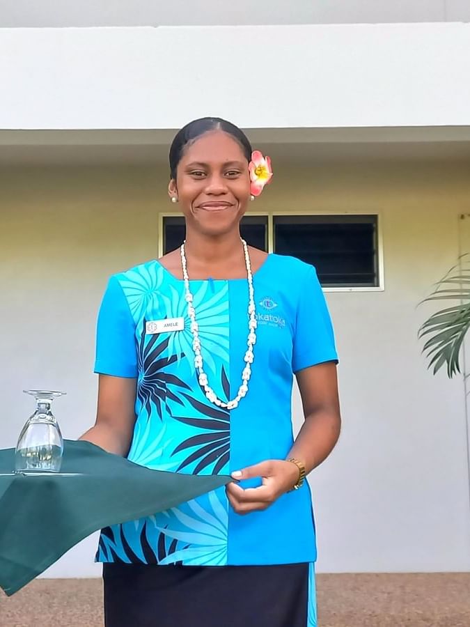 Female room server holding a tea tray, Room Service at Tokatoka at TokaToka Resort Nadi Fiji
