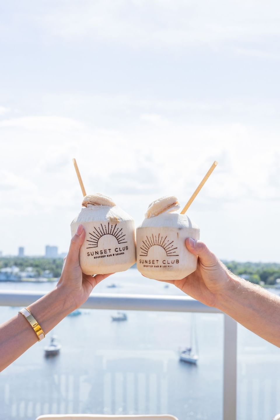 Toasting with trimmed coconut cocktail at Costa Beach Resort