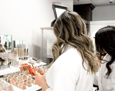 Two women browsing makeup products in Sun Tree Spa at Temple Gardens Hotel & Spa