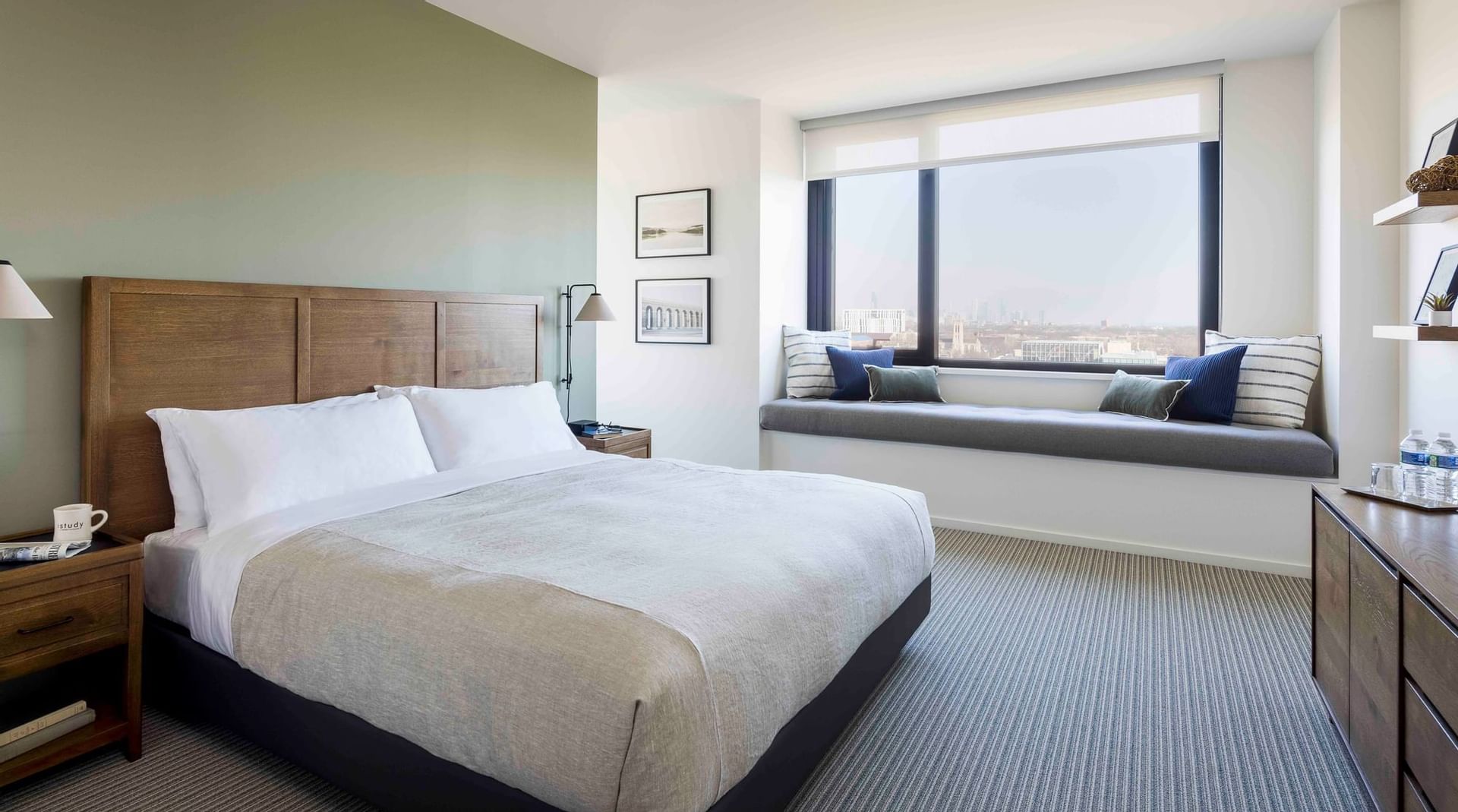 Comfy bed and plush window seat in King Study at The Study at the University of Chicago
