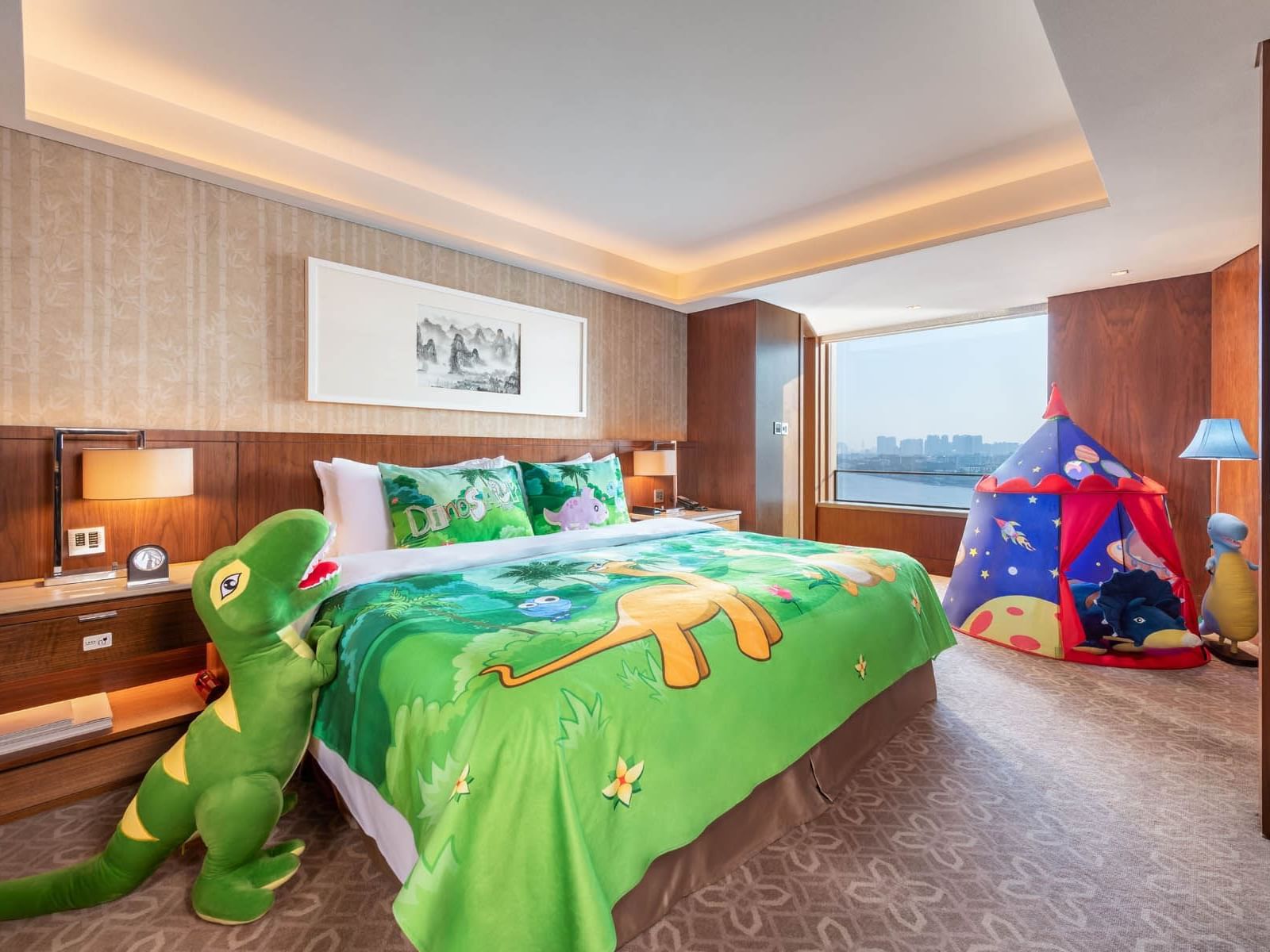 A kids tent & fluffy T rex in Family suite at White Swan Hotel