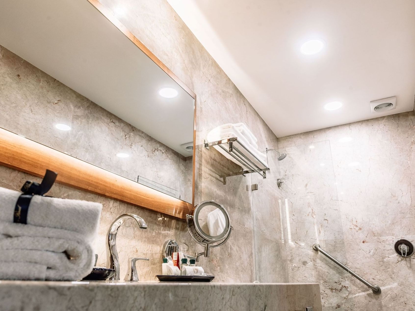 Bathroom counter with amenities and shower area in the 2 Double Grand Class Suite at Quinta Real Oaxaca