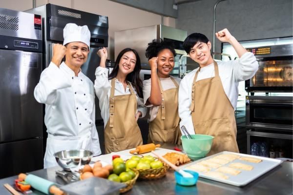 Colleagues at a cooking class, a great team day out after meetings