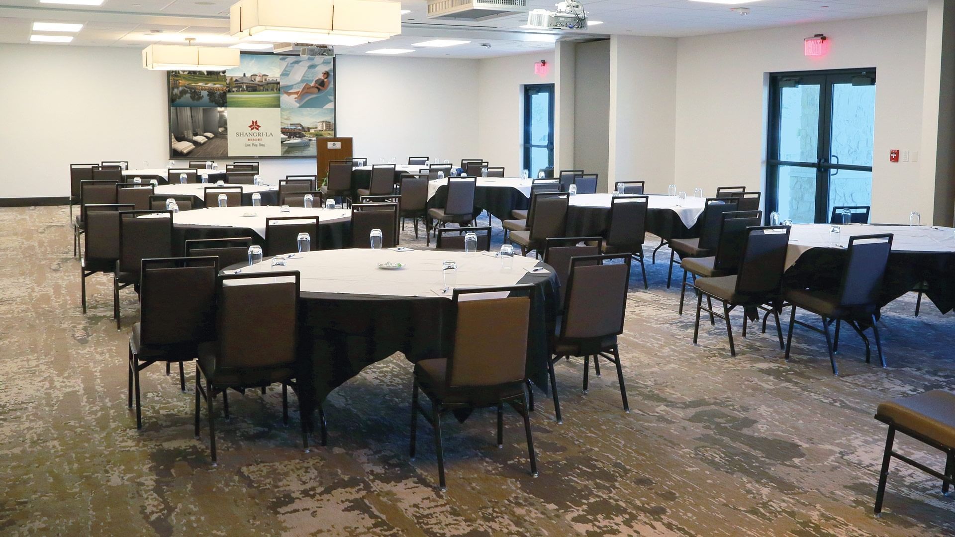 Several round tables set up in Holderman Ballroom at Shangri-La Monkey Island