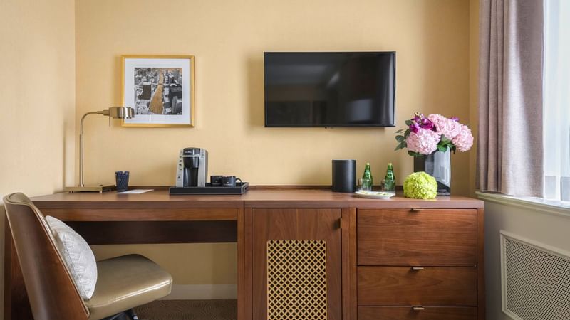 Work desk, chair & a wall TV in Queen Room at Warwick Allerton - Chicago