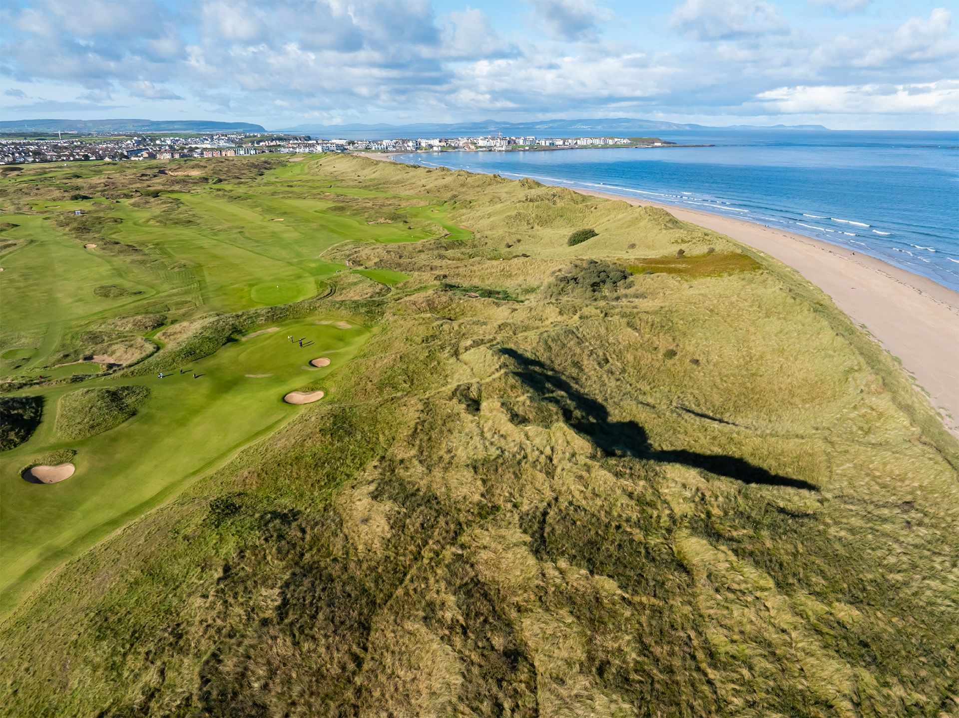 Aerial view of royal portrush golf club with ocean near Dunluce Lodge