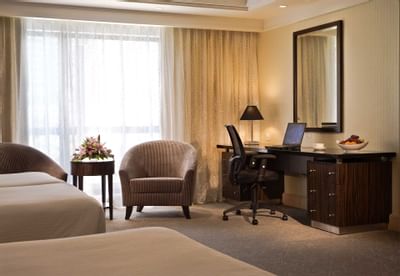 Working desk & loungers by the beds in Premier Room at York Hotel Singapore