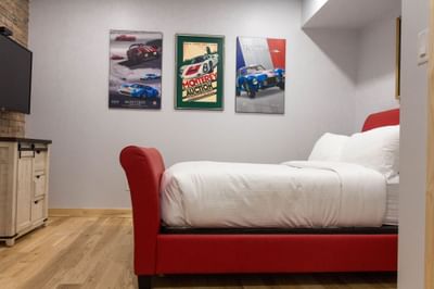 Cozy bed & wall paintings in Apartment 201B at Retro Hotel