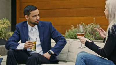 Couple conversing & sipping on wine at The Nest Palo Alto