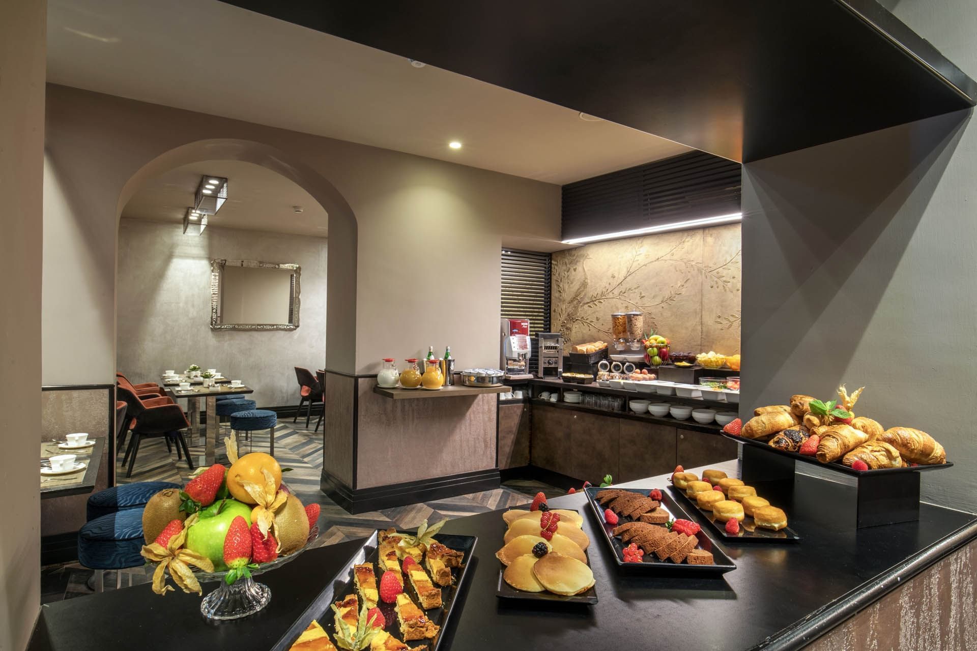 Freshly baked goods arranged on a counter featuring the Breakfast Buffet served at The Style