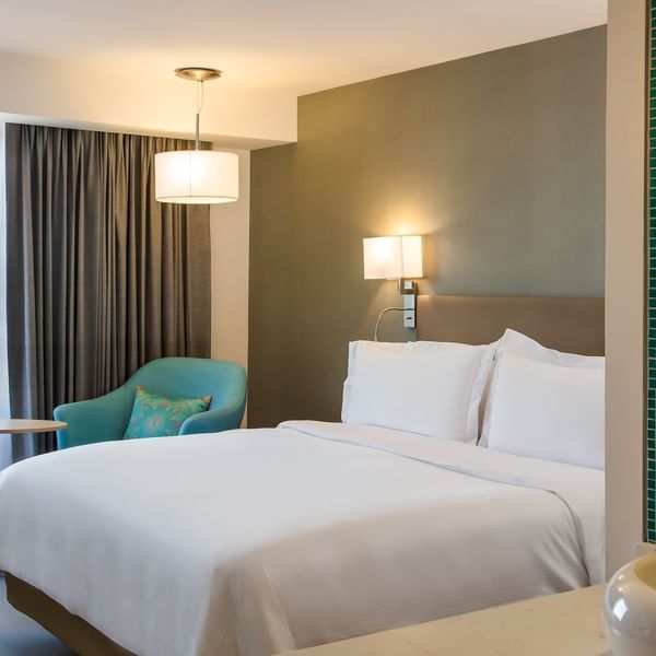King bed with working desk In Accessible Room at Fiesta Inn