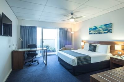 King bed & work desk in Studio Room at Ocean Centre Hotel