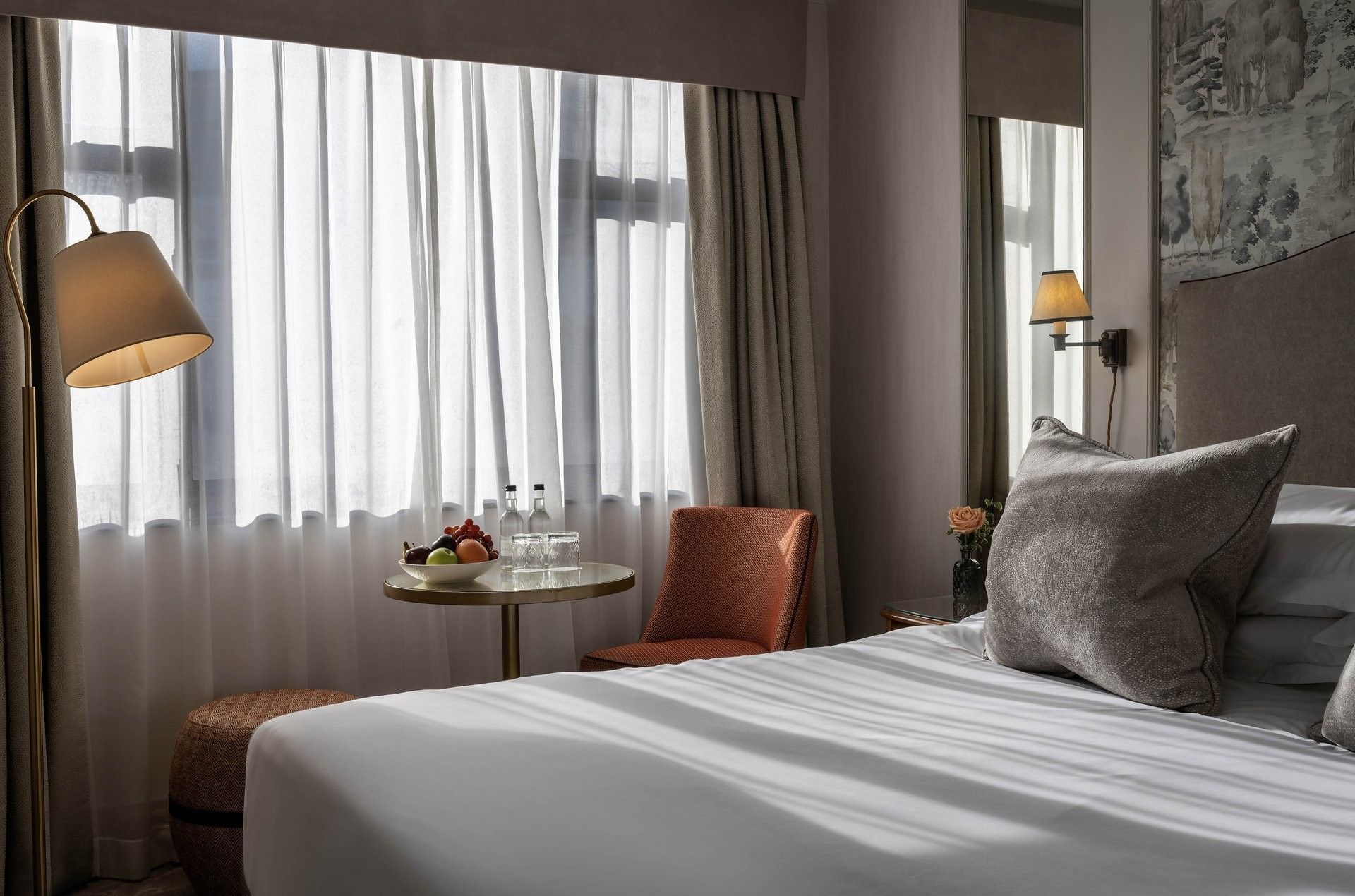 Standard Queen featuring a bed with seating near the window at The Capital Hotel, Apartments and Townhouse