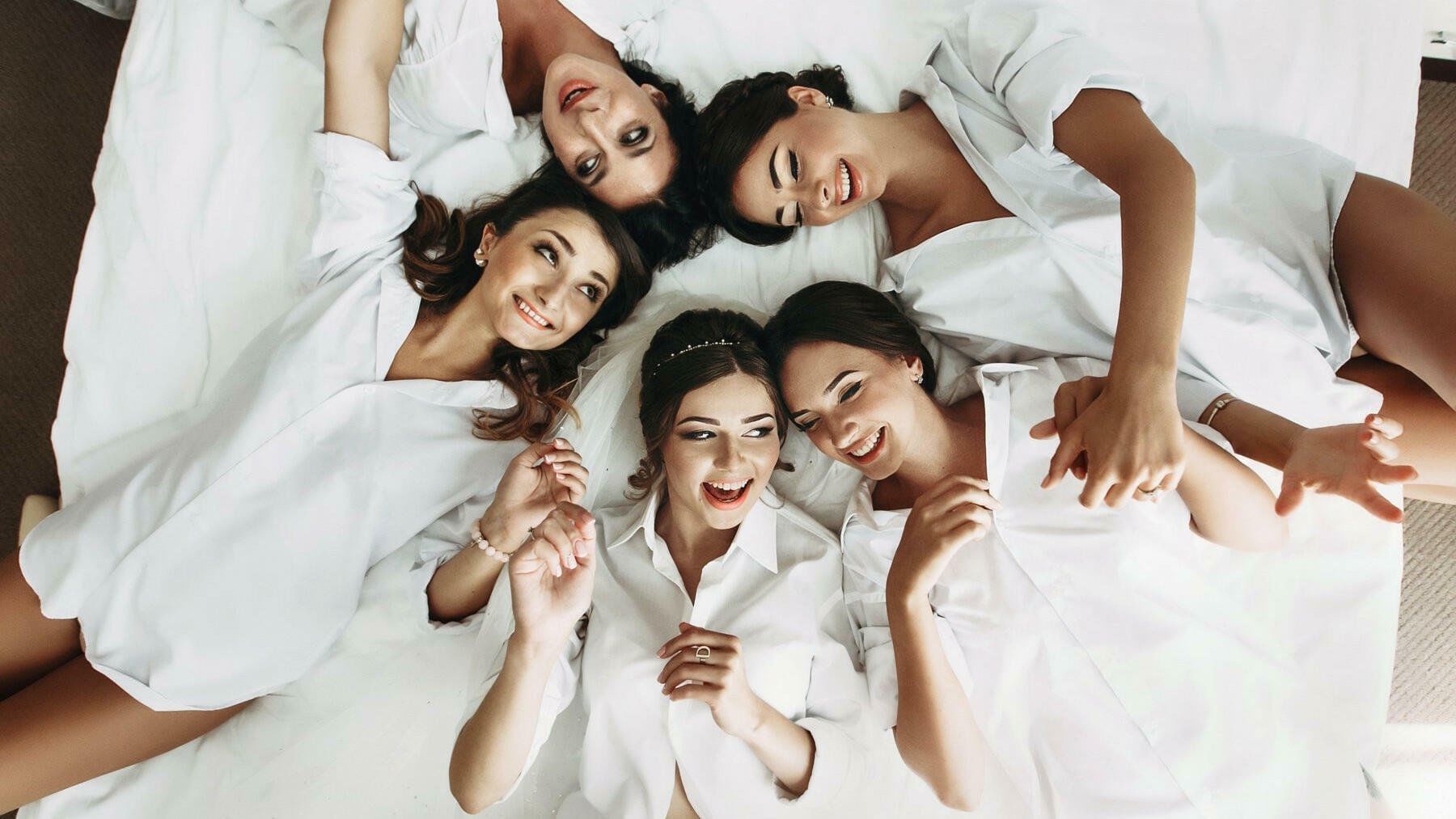 Bridesmaids on a bed at Live Aqua Urban Resort San Miguel