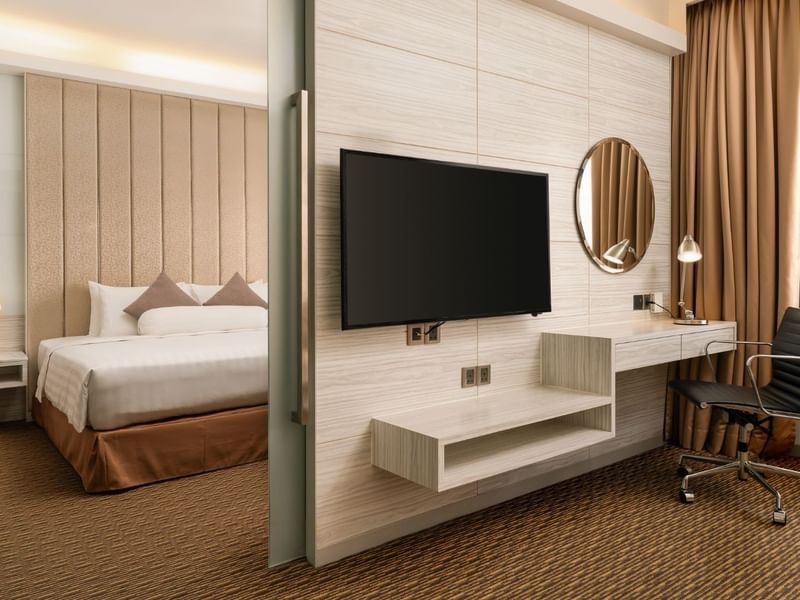 Exclusively furnished Suite room with comfortable king sized bed and premier amenities