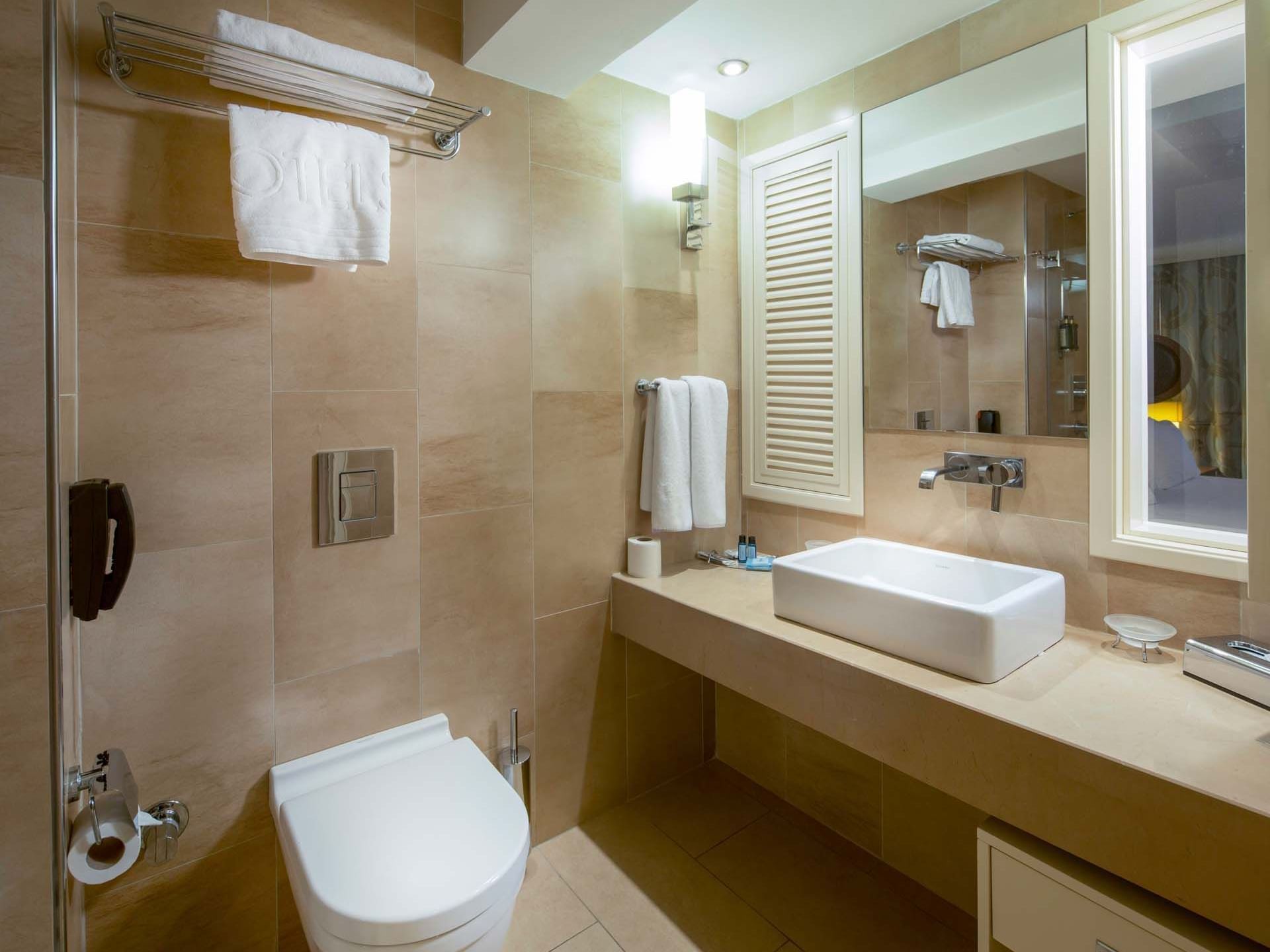 Modern bathroom interior with mirror and vessel sink in Superior Room at Titanic Comfort Sisli