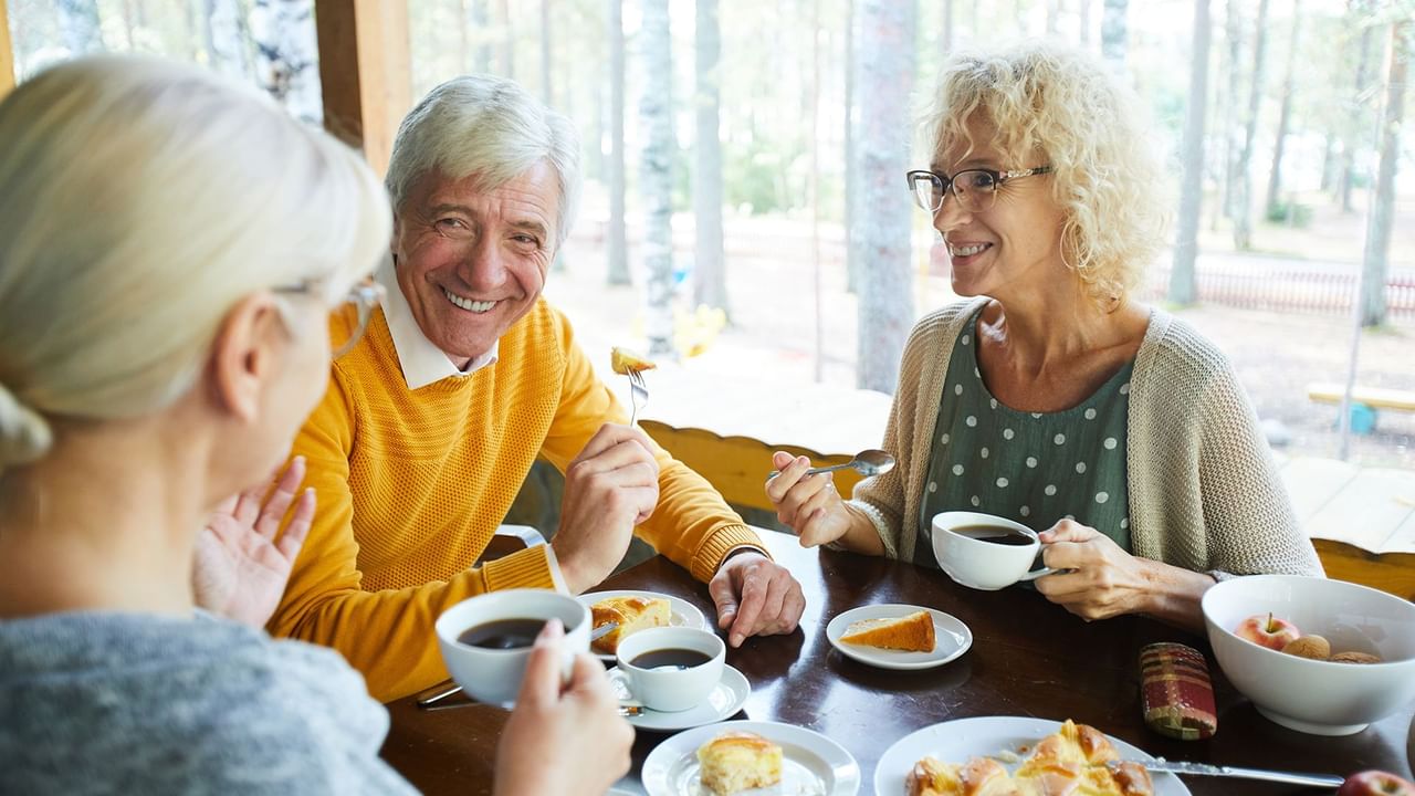 Seniors having breakfast together at a hotel