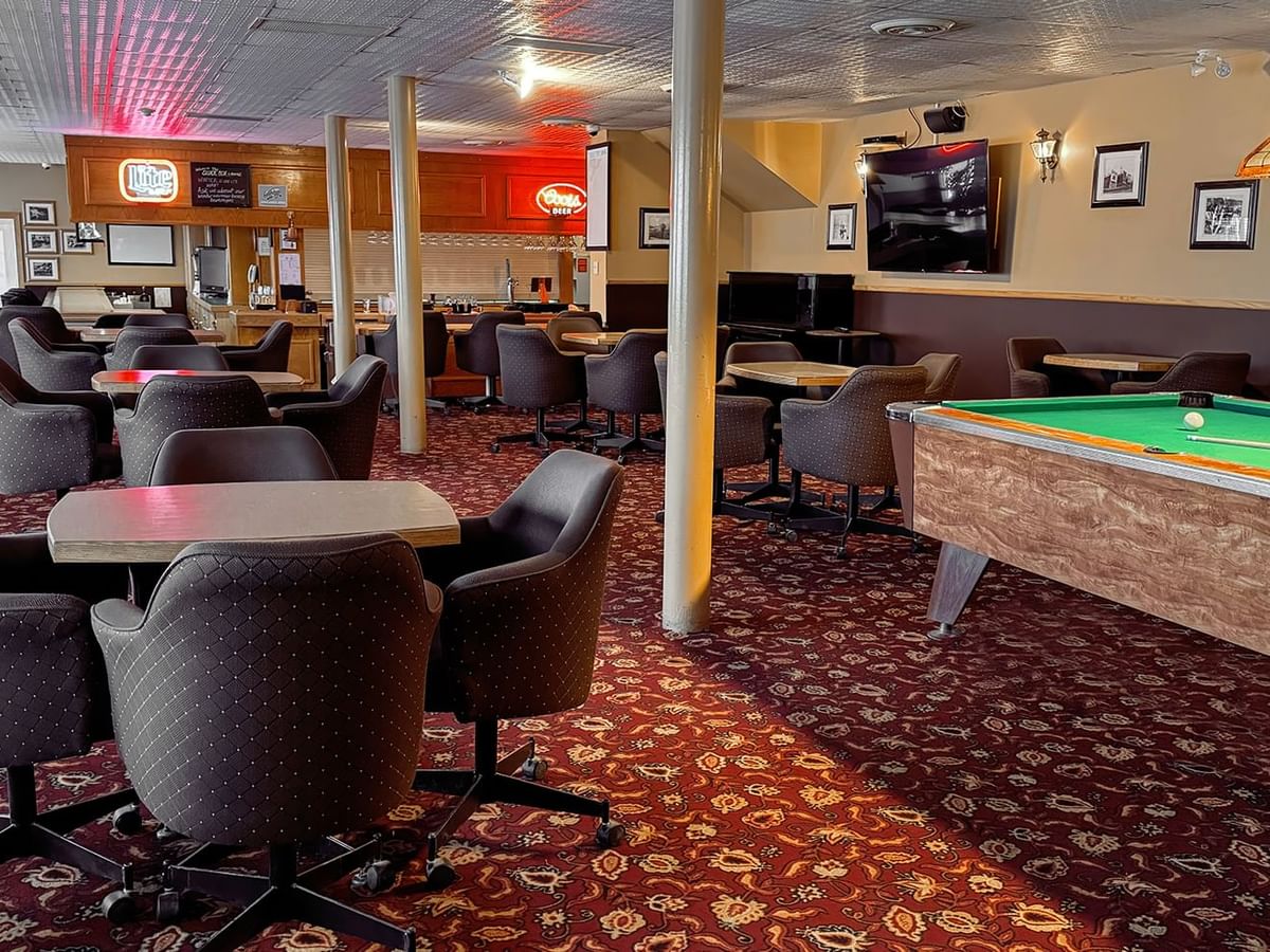seating and a pool table in the Sluice Box Lounge
