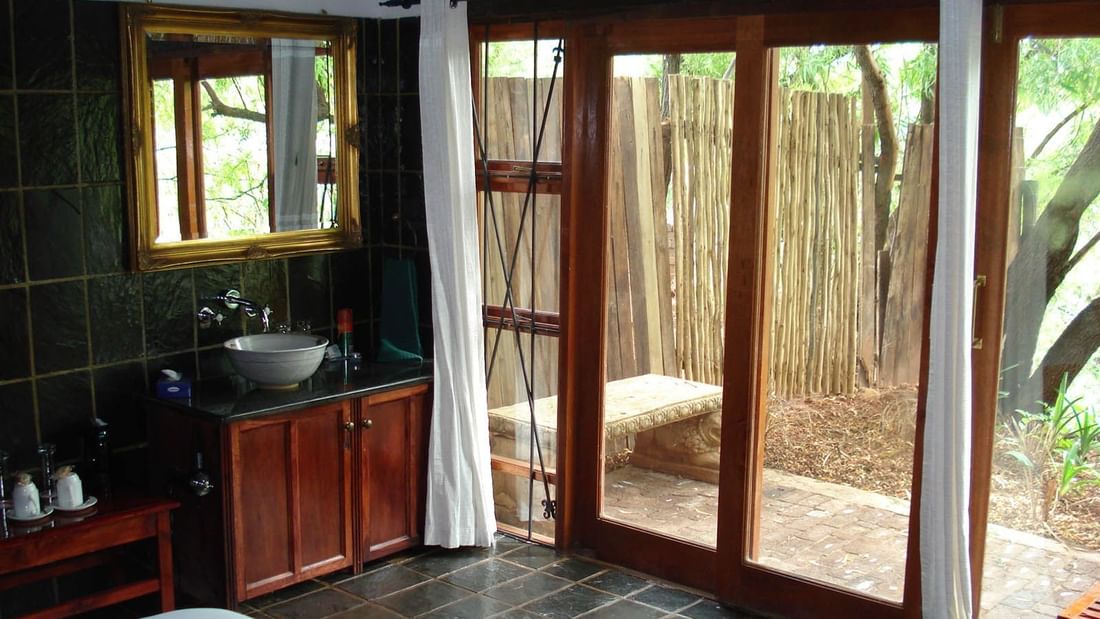 Bathroom vanity by the garden in Lake Side Suite at Kedar Heritage Lodge, Conference Centre & Spa