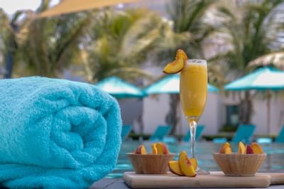Fruits and drinks served by the pool at Bay La Sun Hotel