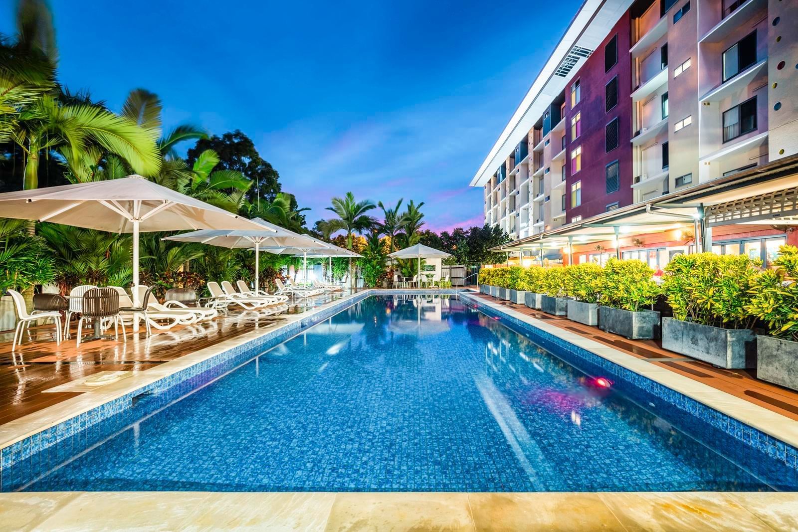 Exterior of the pool with pool beds at Novotel Darwin Airport