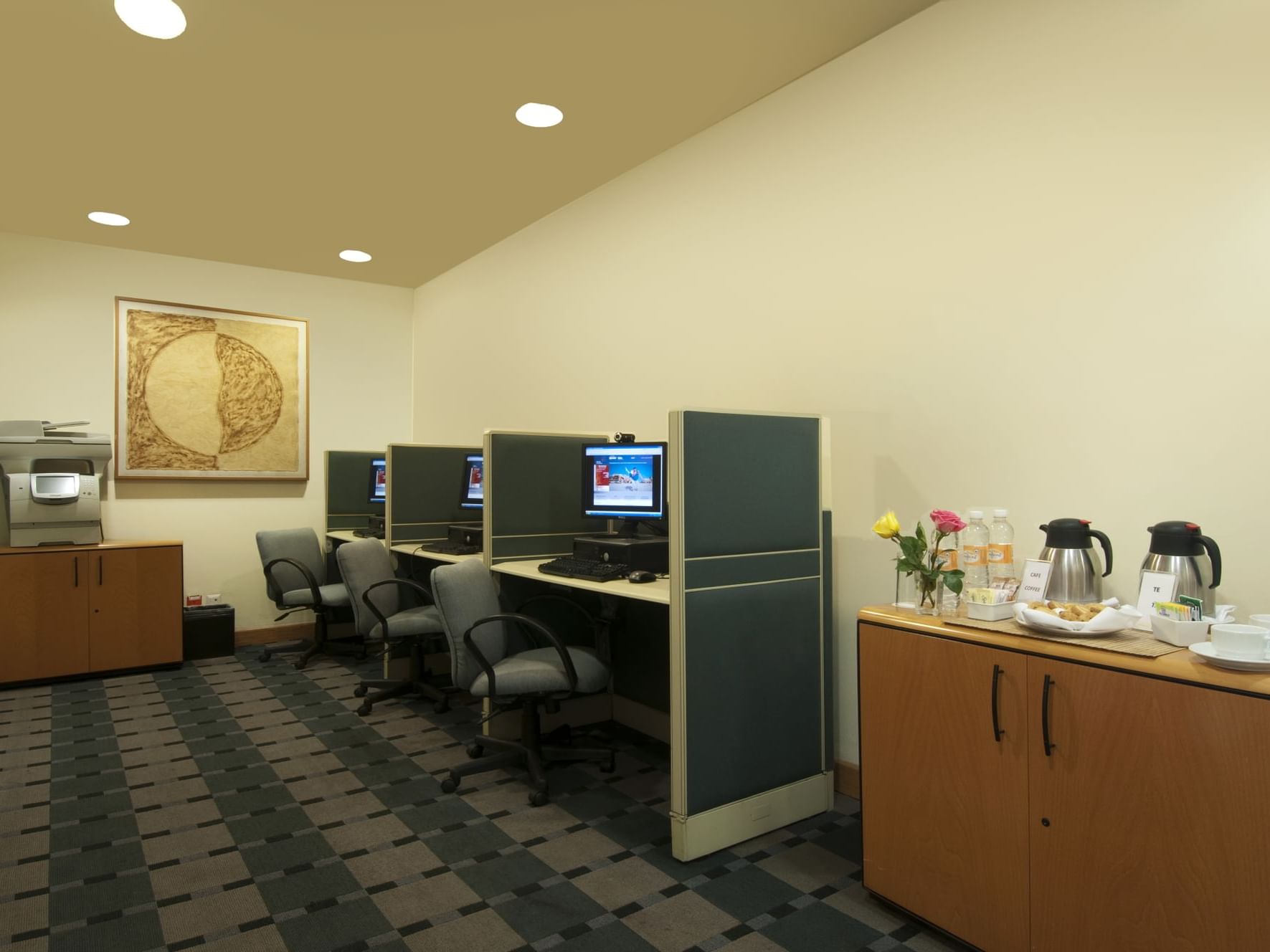 Computers & coffee station in a business center at Fiesta Inn