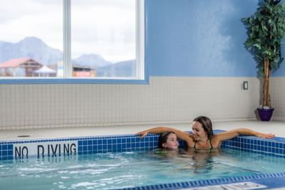 Mother in pool with her child at Stoney Nakoda Resort & Casino