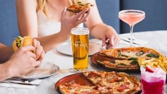 Closeup on guests enjoying pizza served at Novotel Sydney