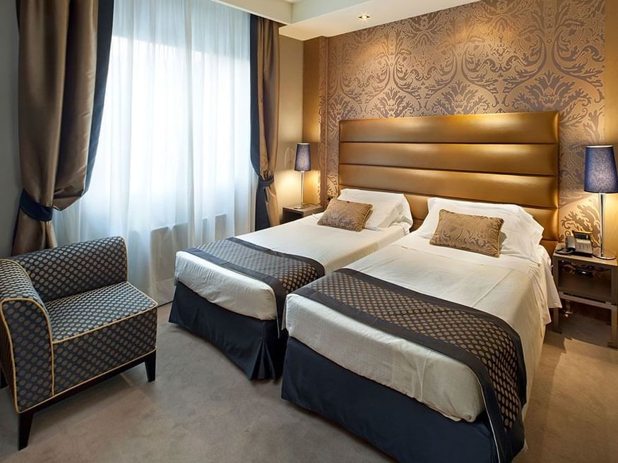 Two beds & furniture in Twin Superior at Extro Hotels