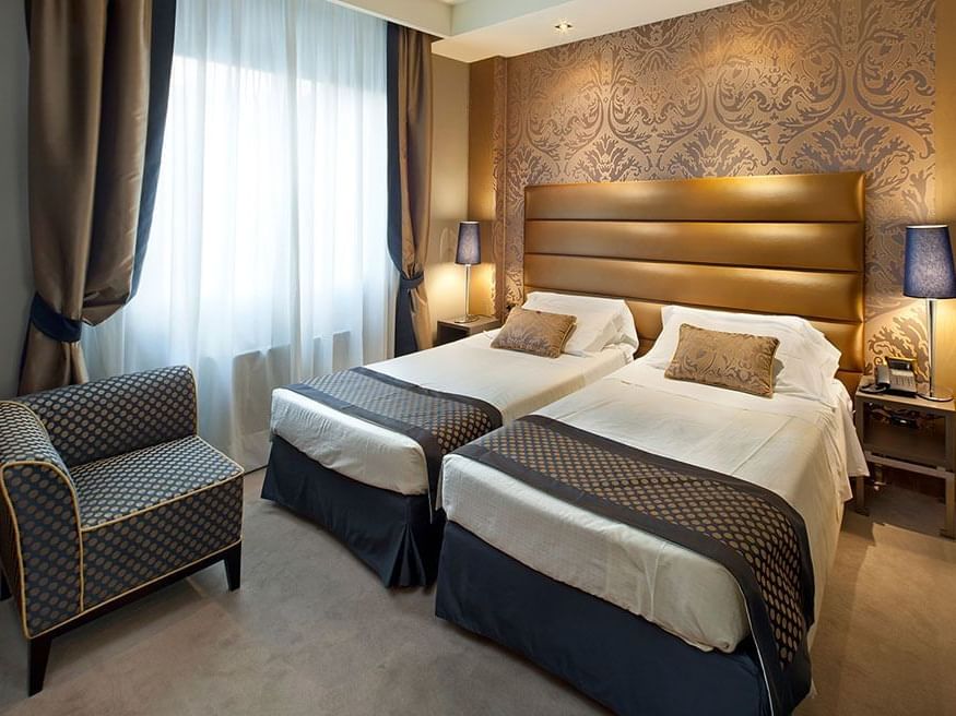 Two beds & furniture in Twin Superior at Hotel Mozart