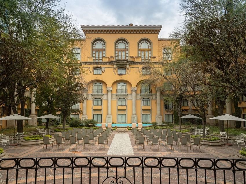 Jardin Plaza Magnolias set in a lush courtyard with grand colonial architecture at Quinta Real Monterrey
