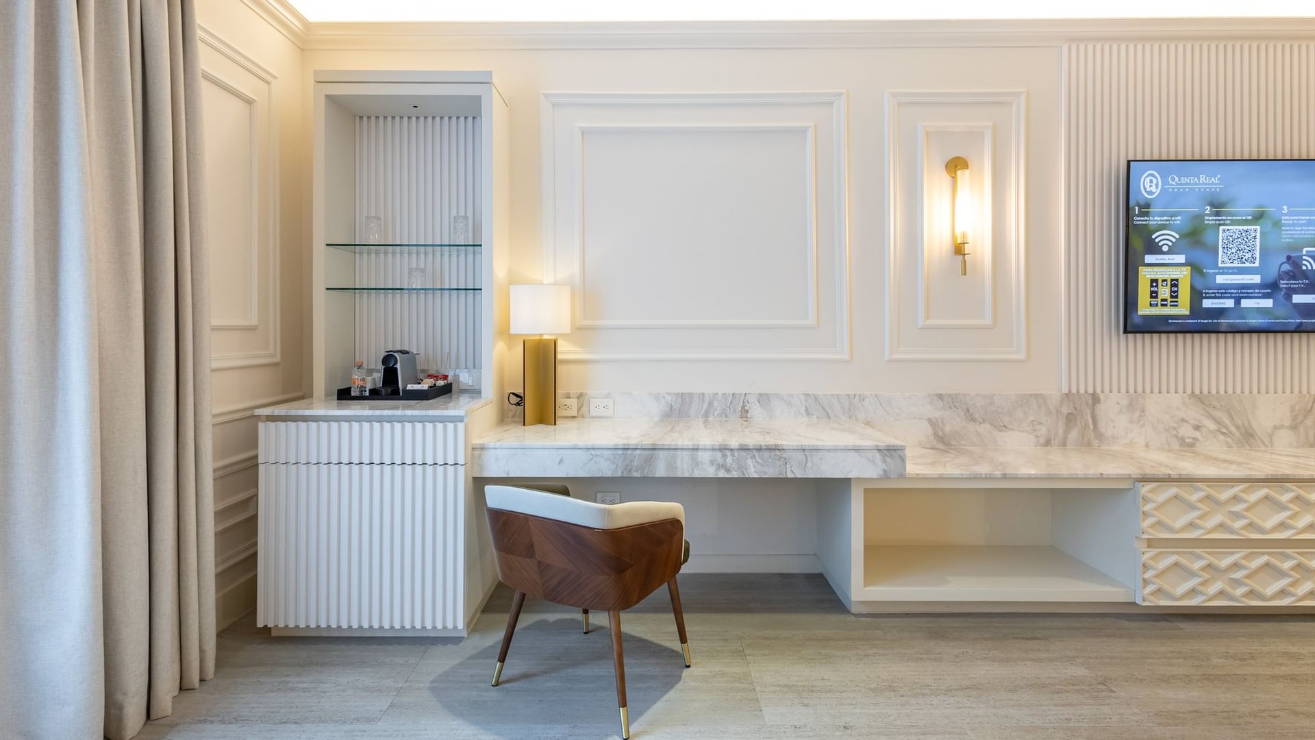 Suite Gran Clase Premium King workspace with marble desk, modern chair, and elegant white paneling at Quinta Real Monterrey