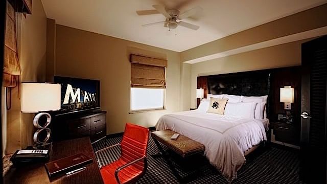 TV, bed & working table in Signature Suite at The Mayo Hotel