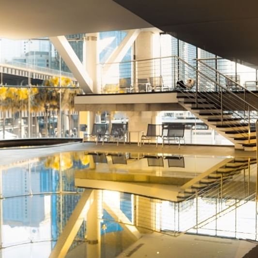 Indoor Pool & loungers at Pullman Quay Grand Sydney Harbour