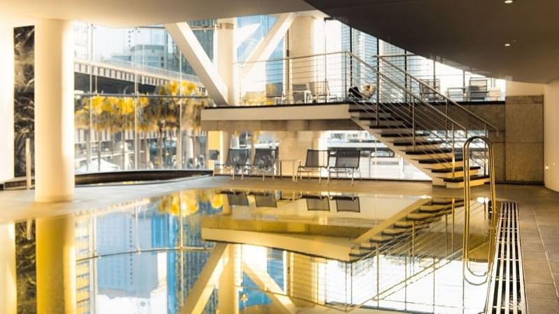 Indoor Pool & loungers at Pullman Quay Grand Sydney Harbour