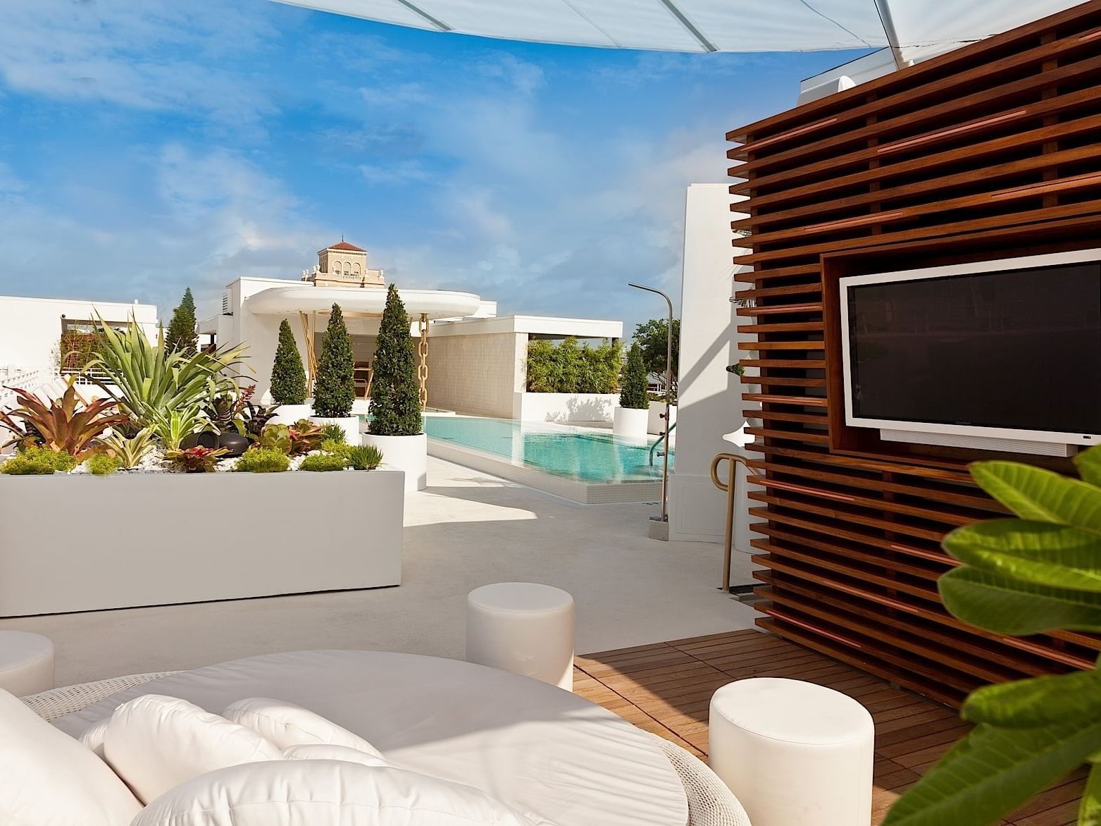 Rooftop cabana with sofa bed & TV at Dream South Beach