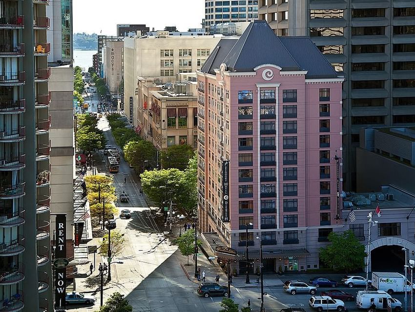 Aerial View of The Paramount Hotel Seattle with a pink facade and a view of the city street and other buildings