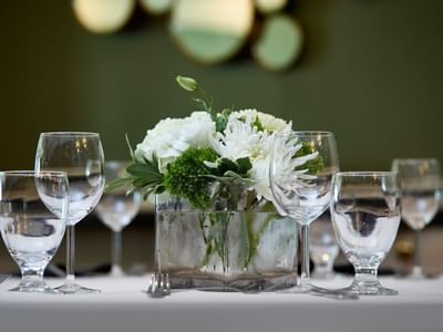Close-up of floral table decorations & Wine glasses at Varscona Hotel on Whyte