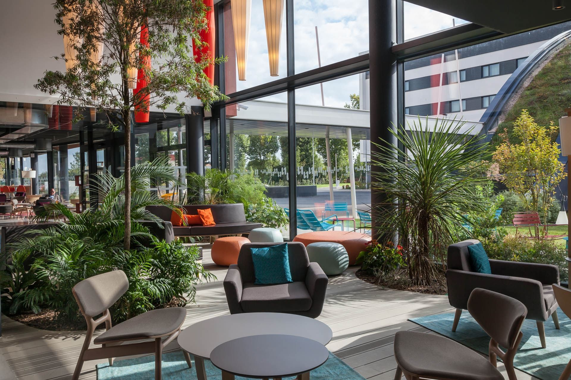 Elegant interior design of lobby area at Nomad Nomad Hotels Paris Roissy