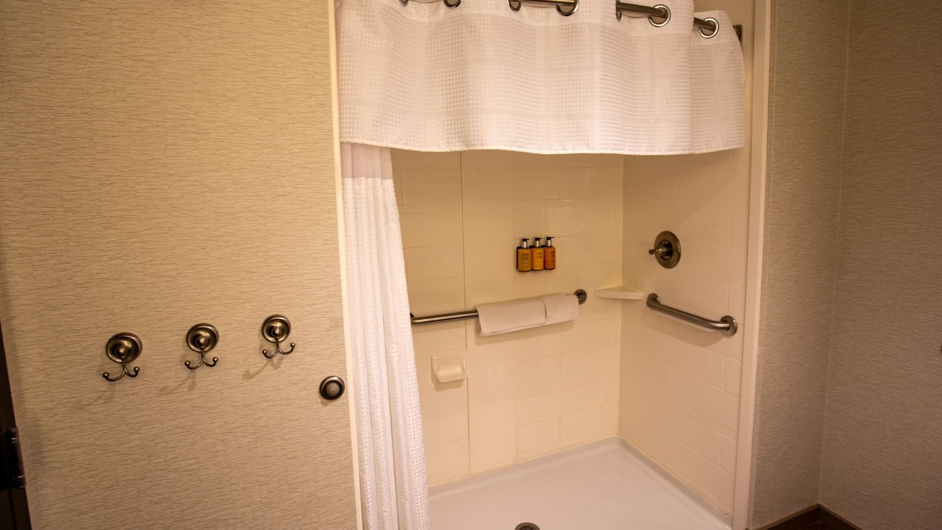 Modern bathroom shower area in accessible king room at Shangri-La Monkey Island