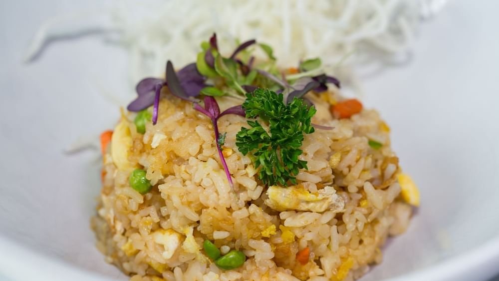 Vegetable fried rice with rice noodles under purple microgreens in Tings on a Stick at Warwick Paradise Island Bahamas